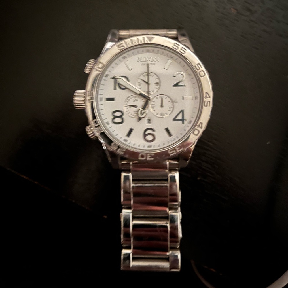 Nixon 51-30 High Polish, stainless steel, white face and silver numbers.